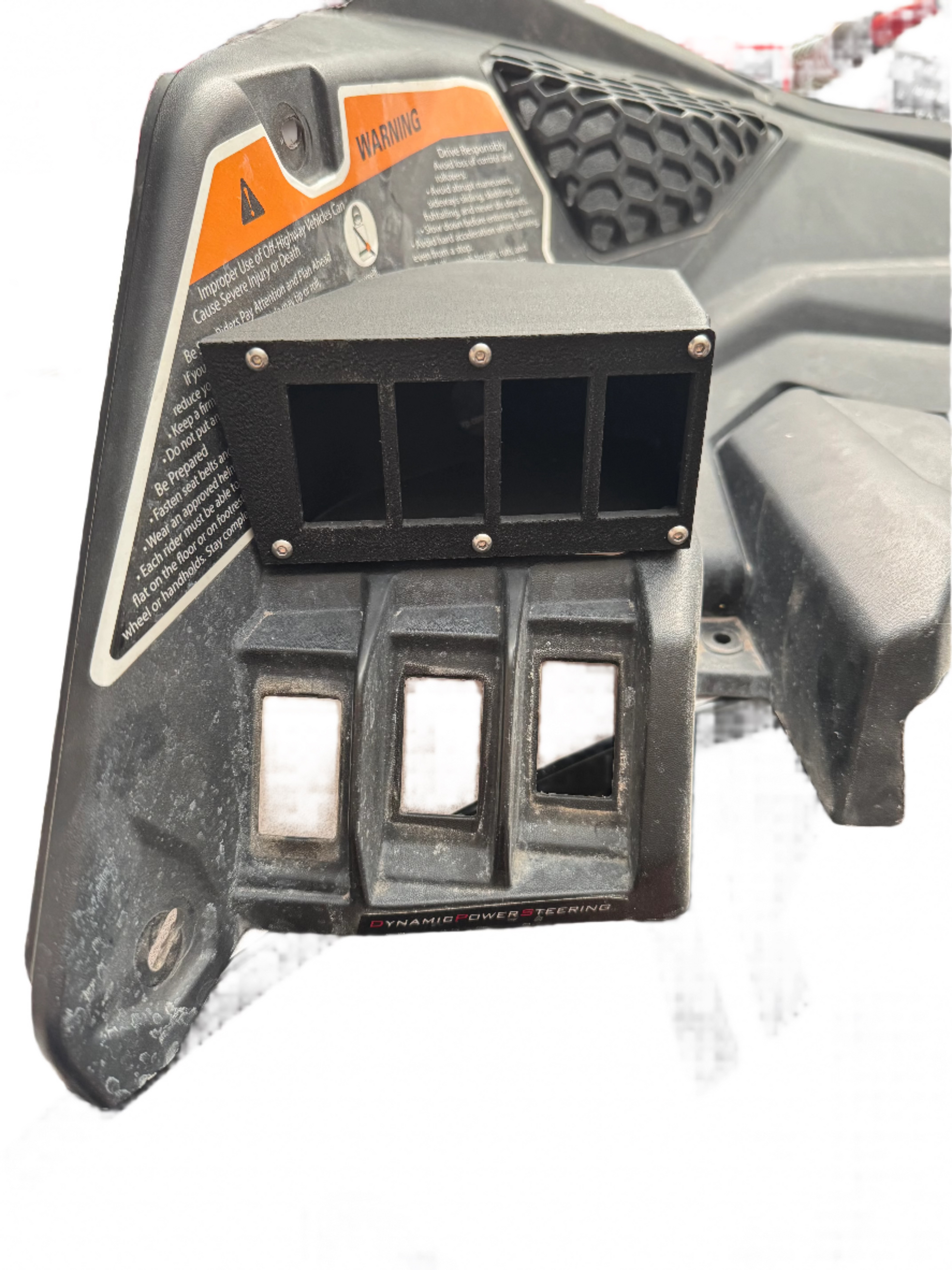 Angled view showing seamless fit of switch panel on Can-Am X3 dash, custom 3D-scanned design.